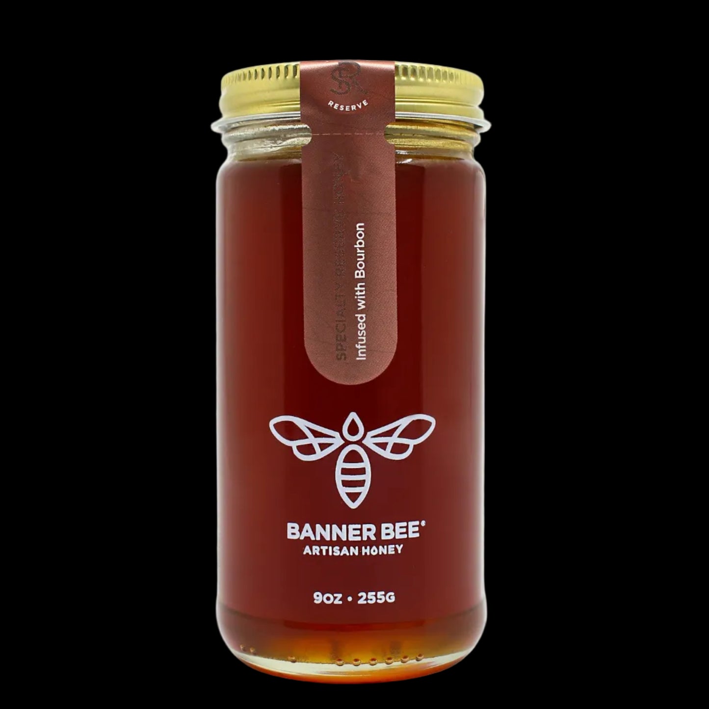 Jar of Banner Bee Artisan Honey with a gold lid on a white background